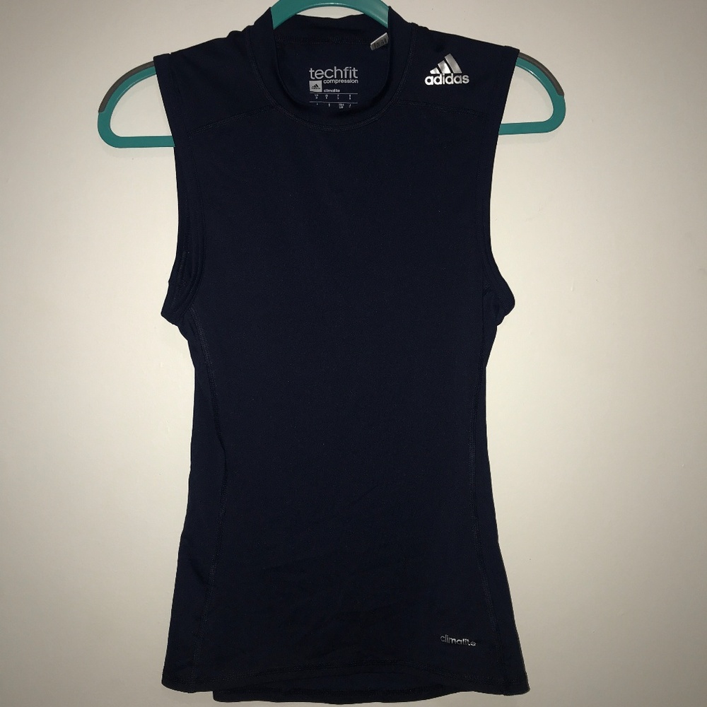 Sleeveless navy adidas compression shirt.